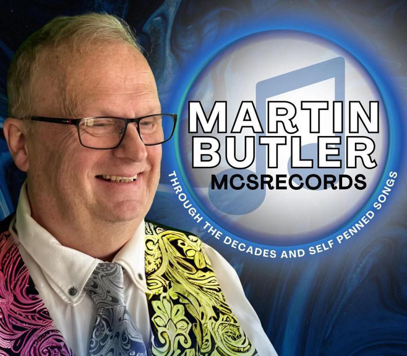 Martin Butler wearing a bright patterned waistcoat and tie