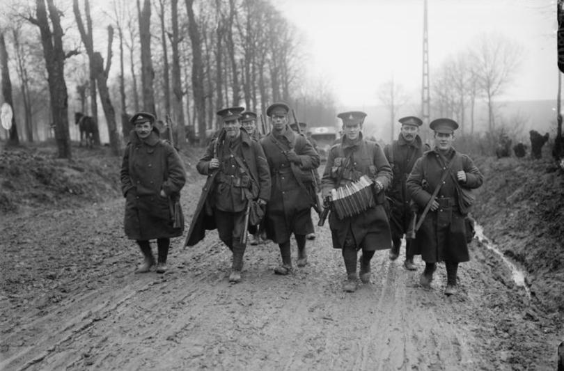 soldiers marching along road in the Somme area of France during World War One