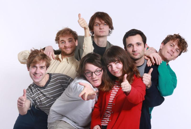 Personal Trainer stood in a group with thumbs up