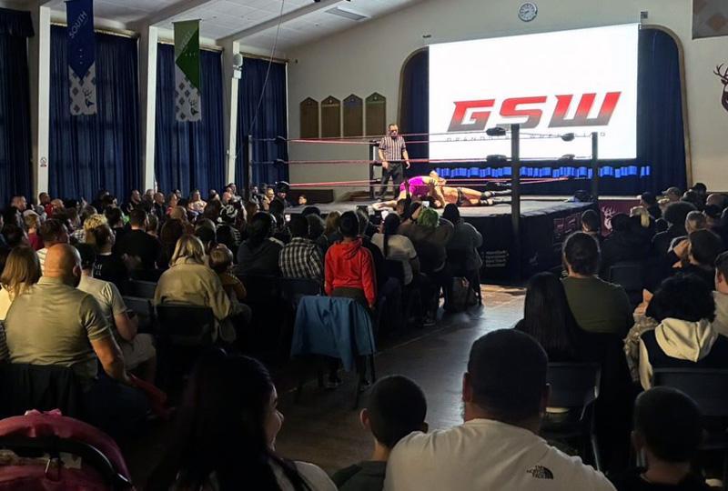 Wrestling match and crowd at Prospect Kings Academy school