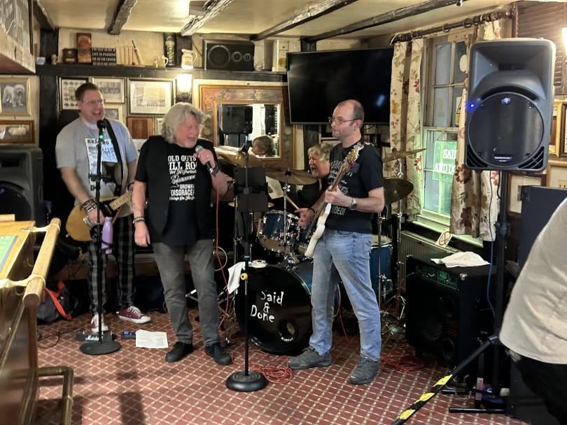 pub rock band playing rock in a pub