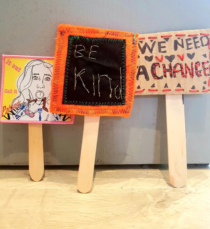 lollypop sticks with sewn banners on top