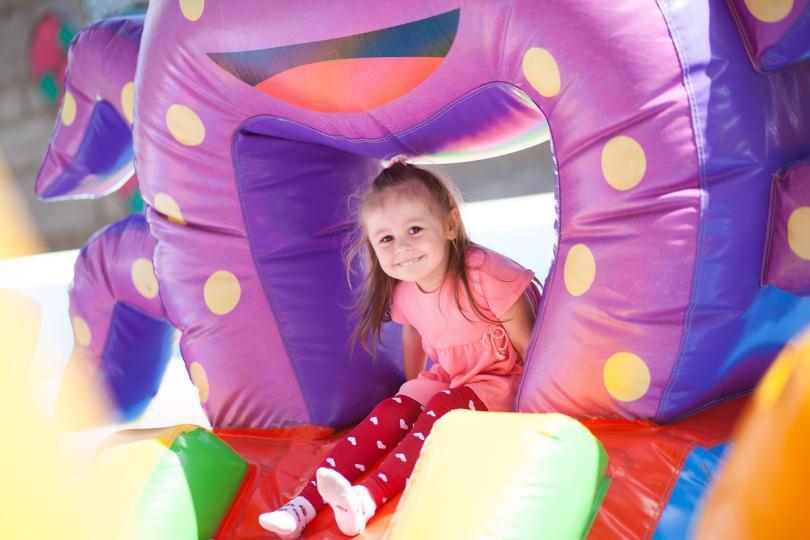 Young girl on a bouncy castle