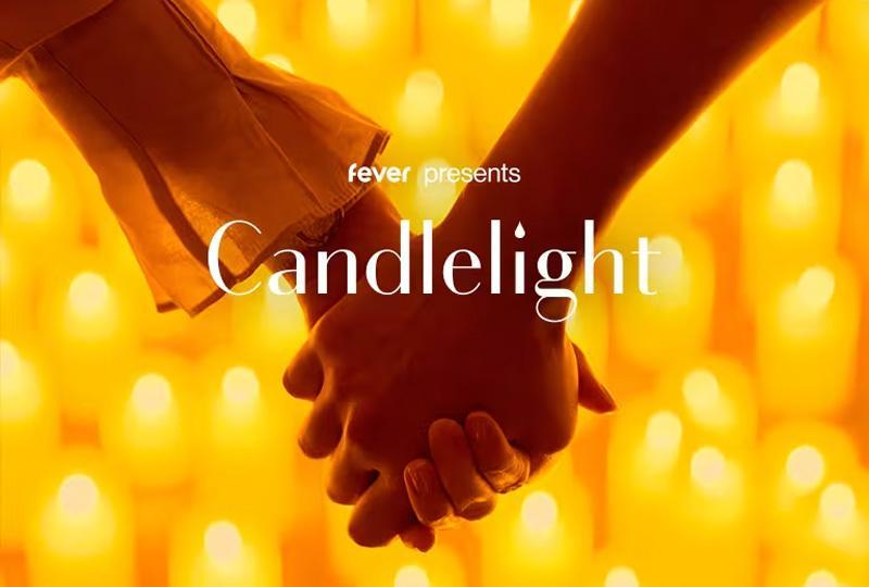 The word "candlelight" over an image of two people holding hands