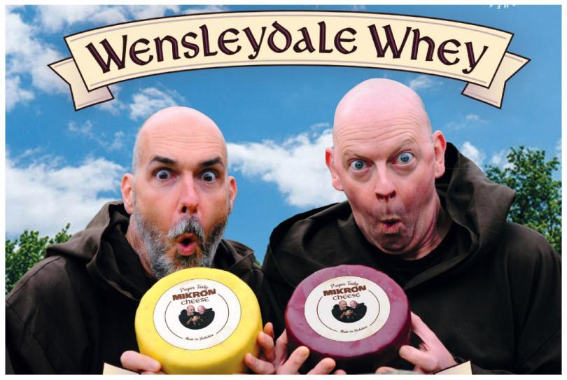 Event poster with two balding actors holding wheels of cheese