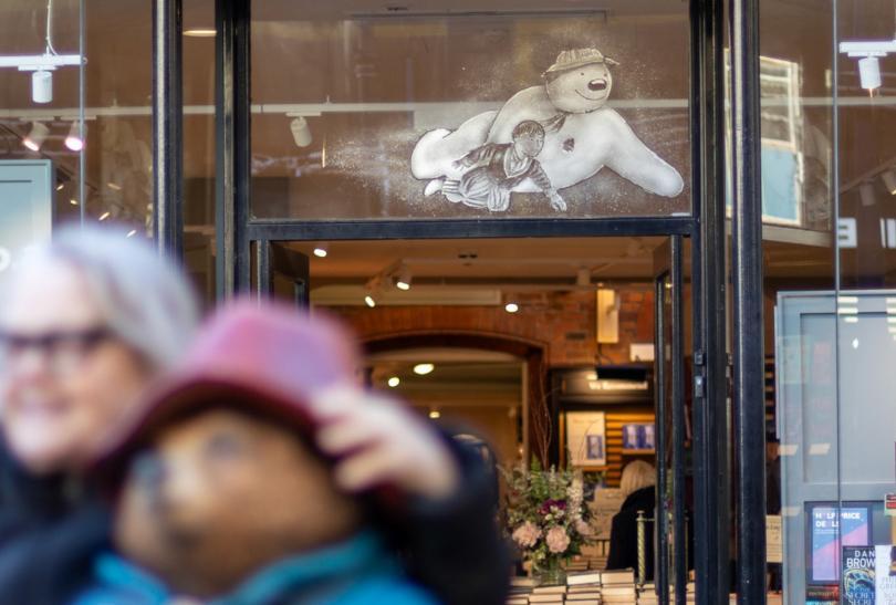 Shop window painted with a snow-effect Snowman (the Raymond Briggs version)