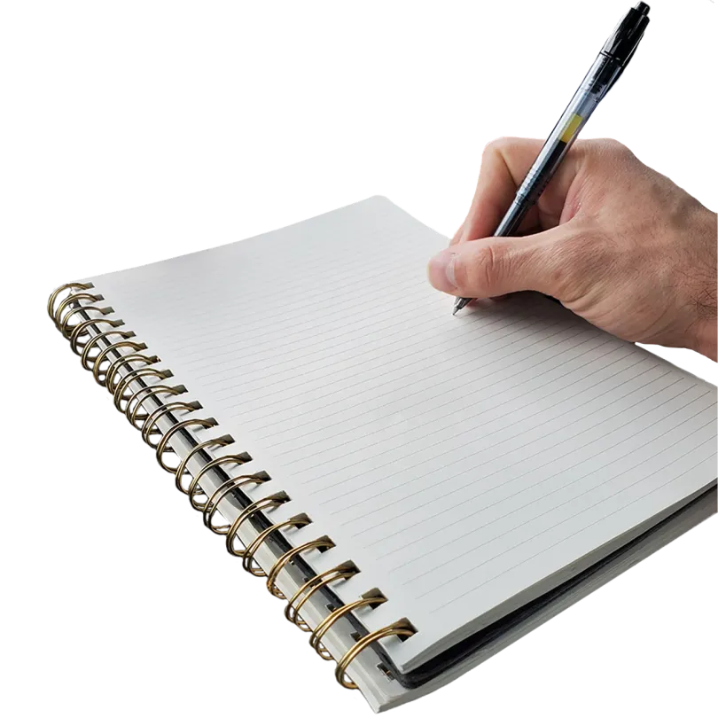 Image of a hand holding a pen over a blank writing pad