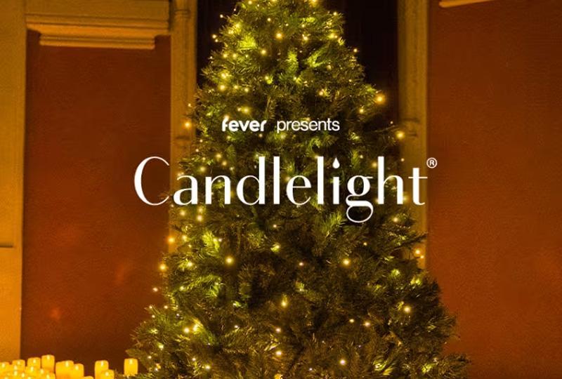 The words "fever presents Candlelight" over an image of a Christmas tree