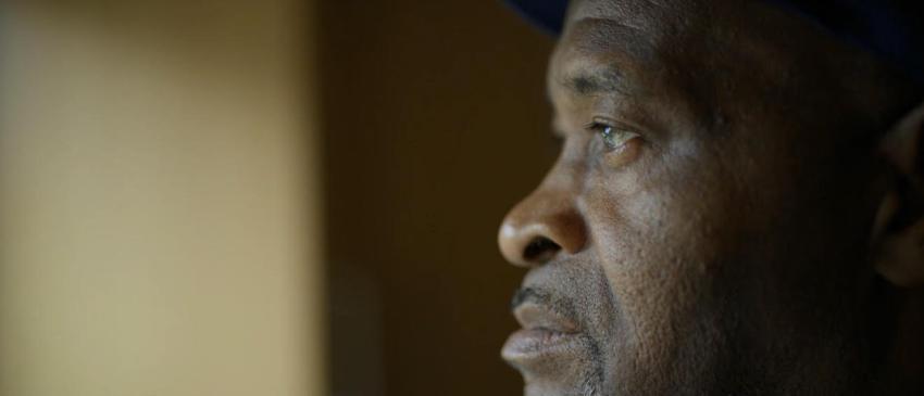 Man's face looking out of the window