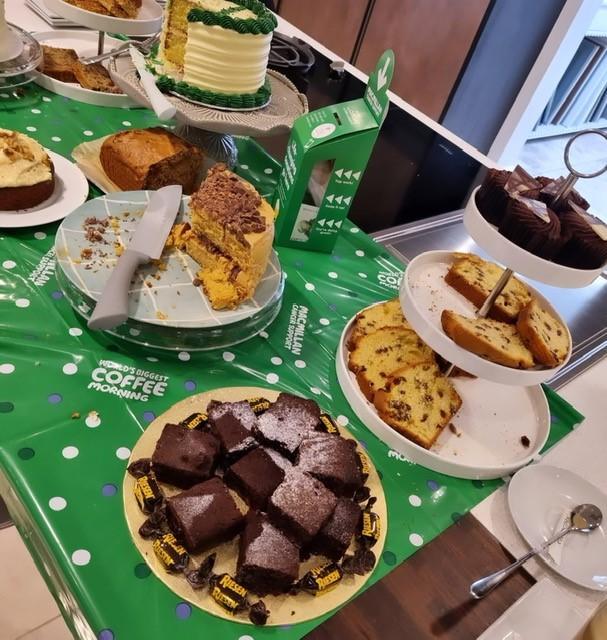 Cakes on kitchen counter with Macmillan table cloth