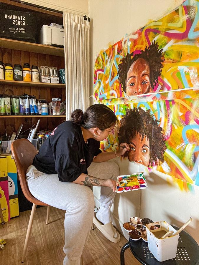 Gemma painting her peice