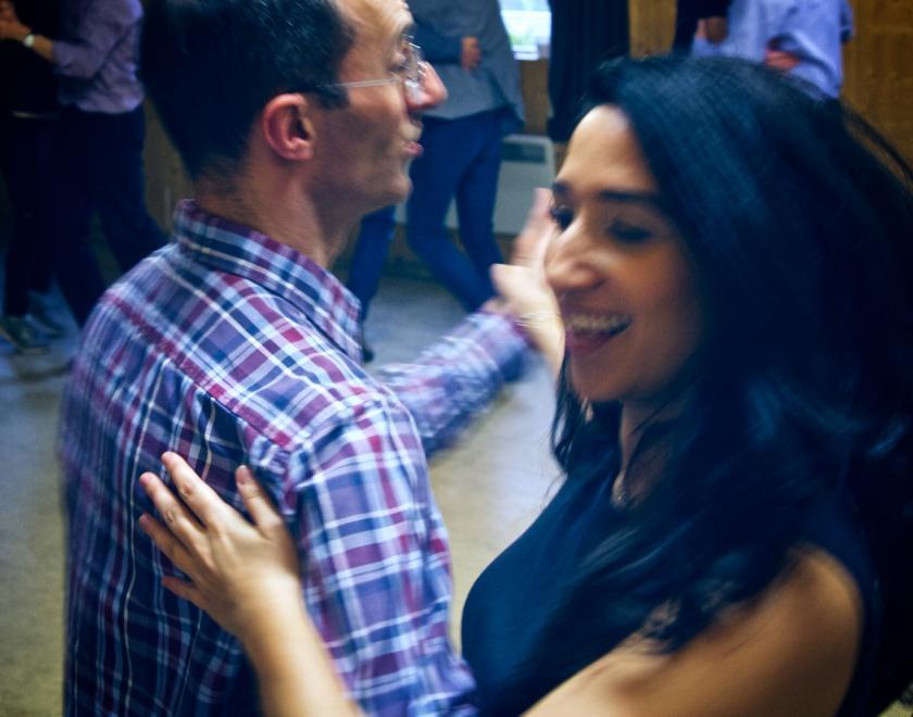 A happy man and a woman dancing together at Reading Balfolk