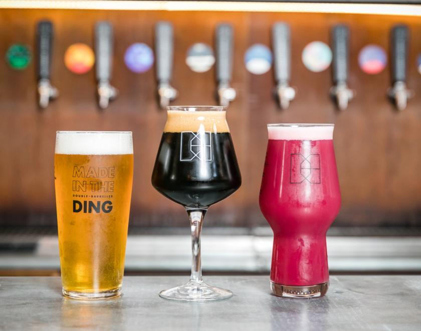 Beers in glasses on the bar at Double-Barrelled Brewery in Reading