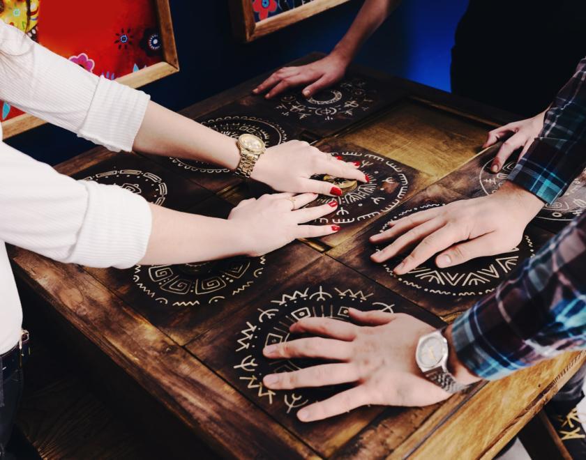 Hands on a puzzle board