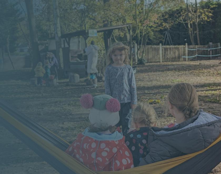 A child and adult playing outside
