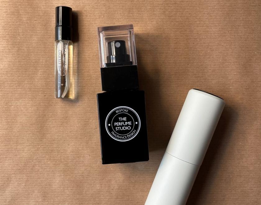 bottle of perfumer with the Perfume studio logo