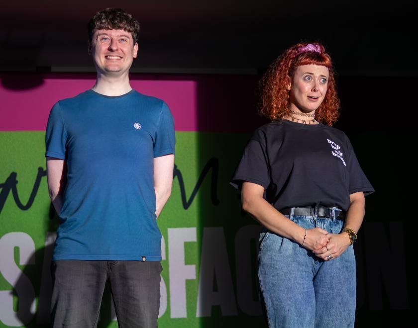 Photo of the two actors standing side by side on stage