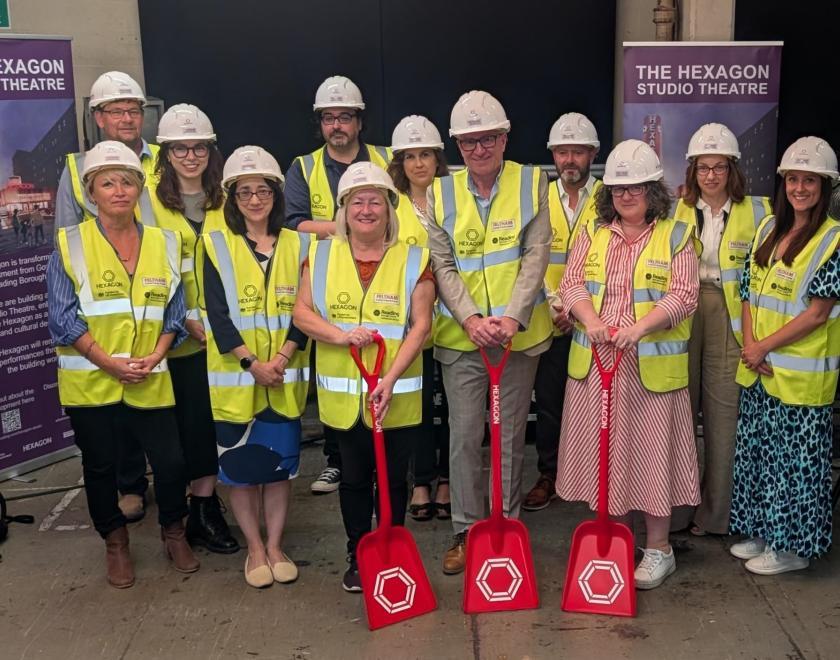 Guests gather in hi-vis to officially commence building work at the Hexagon