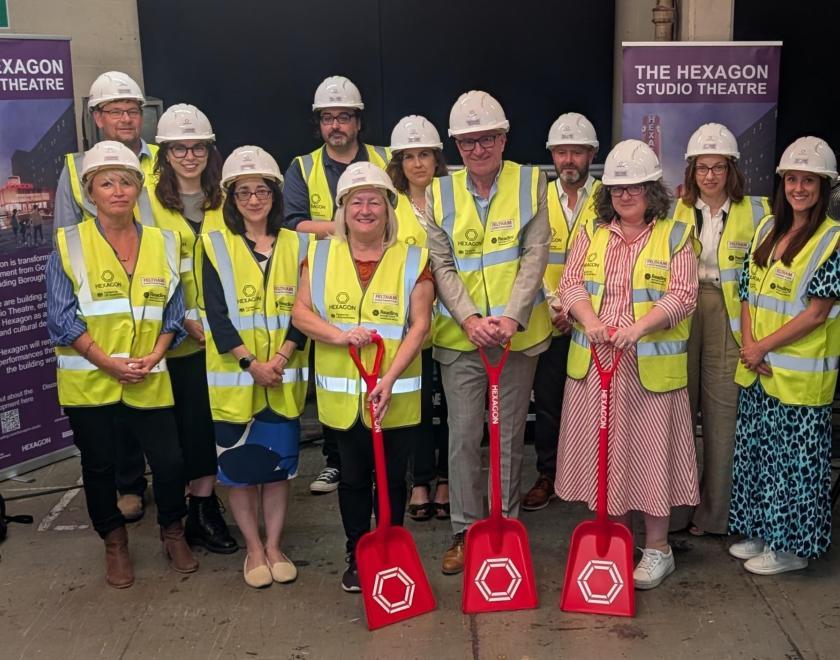 Guests gather in hi-vis to officially commence building work at the Hexagon