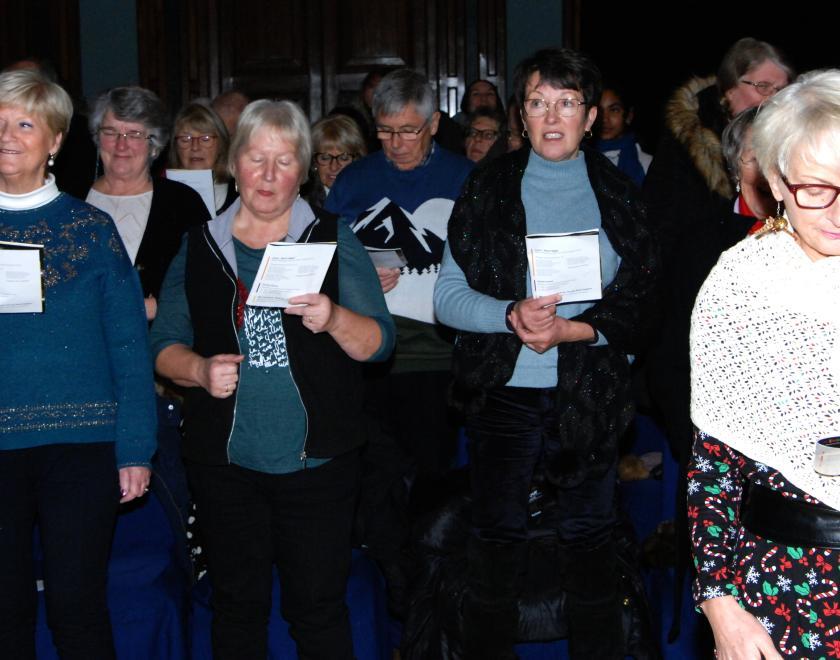 The community sings at the 2023 Launchpad Carols By Candlelight