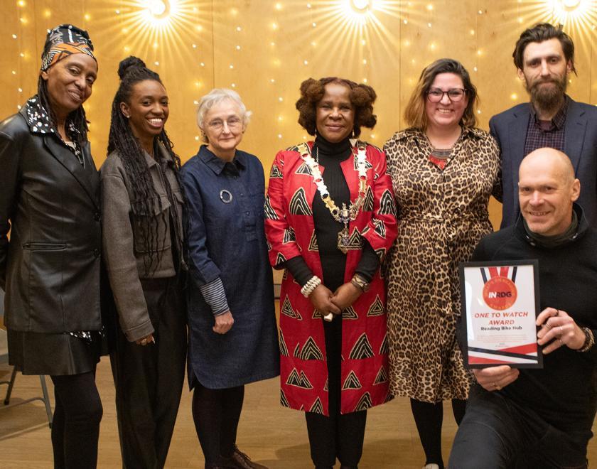 Reading Bike Hub pose with their One To Watch Award certificate alongside presenters Kate Arnold-Foster, Mary Genis and Nathifa Jordan and the Mayor of Reading