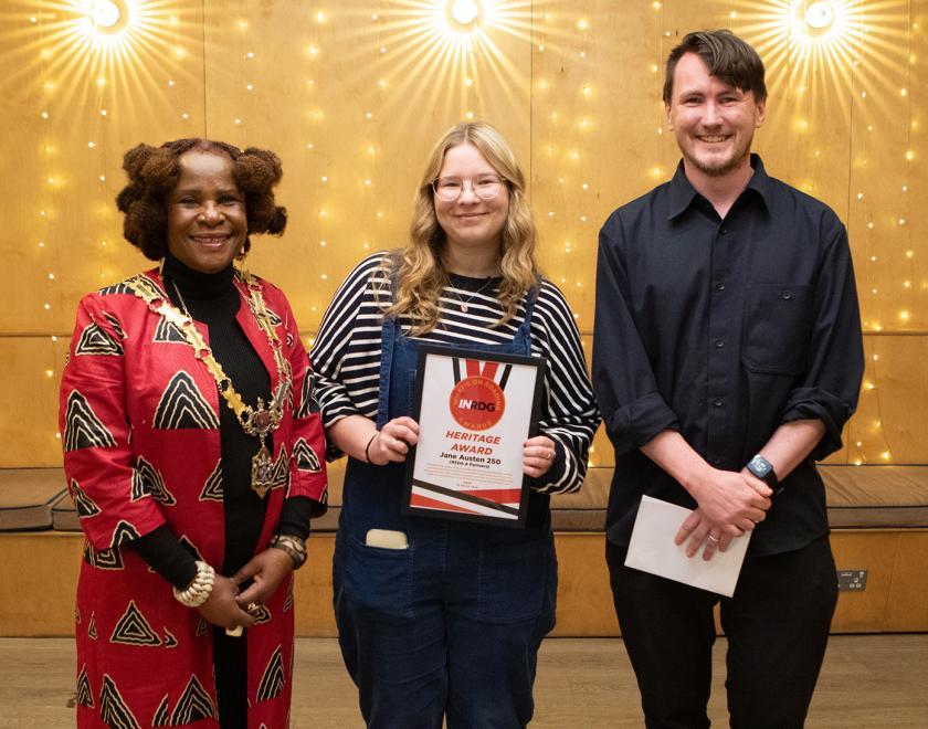 REDA's Emma Matthews poses with the Heritage Award certificate alongside presenter Adam Koraszy and the Mayor of Reading