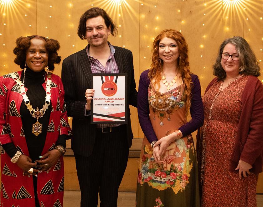 Charlie and James of Deadlocked Escape Rooms pose with the Cultural Ambassador Award certificate alongside presenter Adele Barnett Ward and the Mayor of Reading