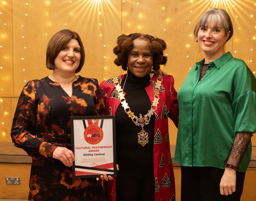 Helen Bligh of Whitley Carnival poses with the Cultural Partnership Award certificate alongside presenter Lorraine Briffit and the Mayor of Reading