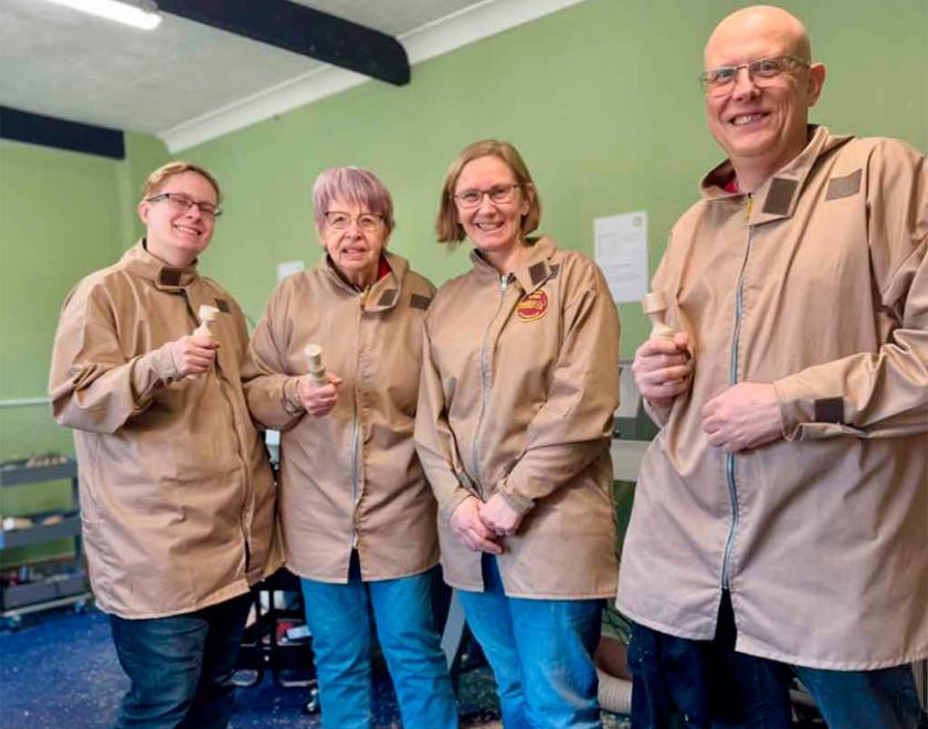A group of happy woodturning students.