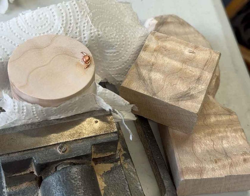 The finished box next to a piece of the special wood it was made from.