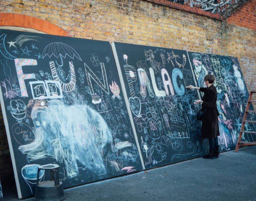 Blackboards with the words Fun Palaces chalked on them. 