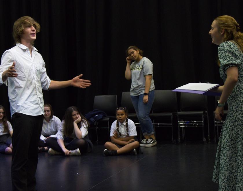 Young performers being guided by their performance tutor