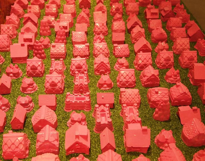 sculpture of small red houses 