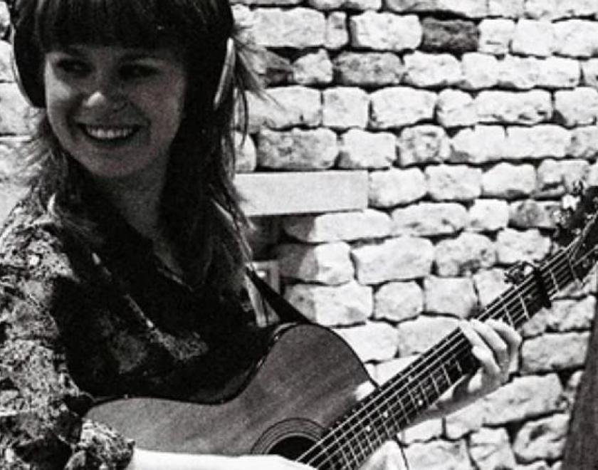 Katie Spencer plays guitar