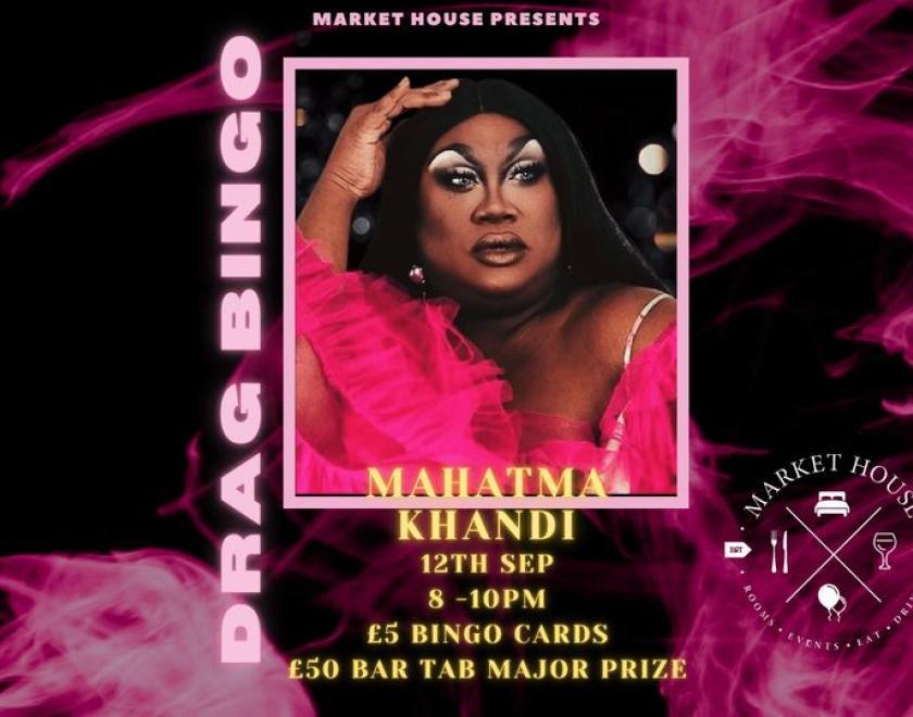 picture of mahatma khandi in front of a pink background