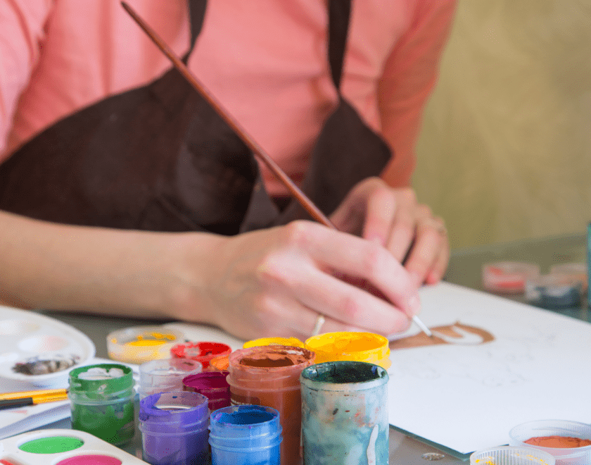Person using acrylic colour paint