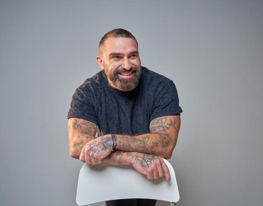 Ant Middleton leaning on a chair