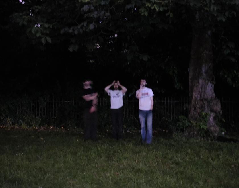 band image of them in a wood's in the dark