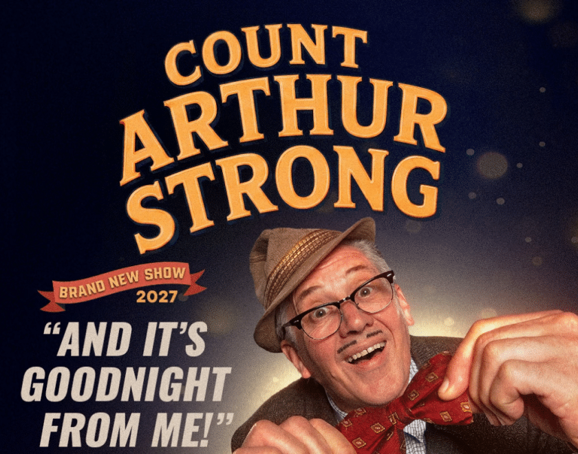 Count Arthur Strong wearing a hat and a bow tie
