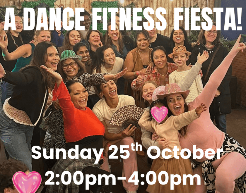 Dance class participants in a big group pose