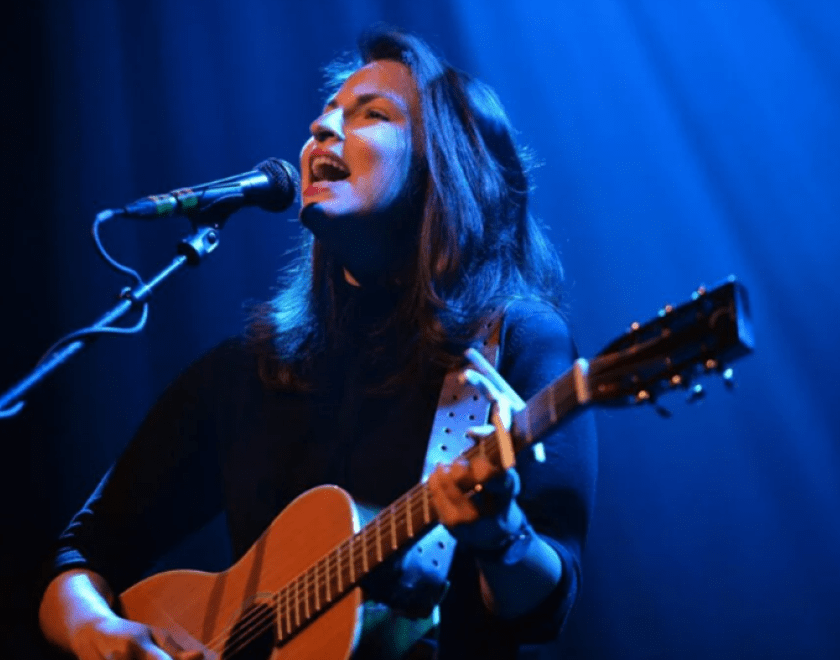 Danni Nicholls playing guitar