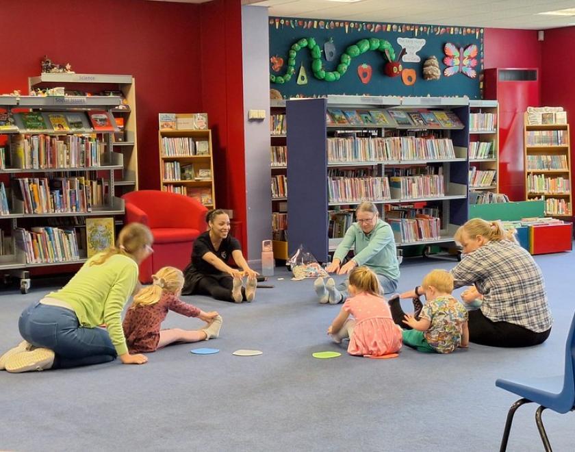 Families enjoying an introductory ballet session for under-fives in a library
