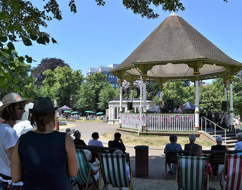 crowd watching a band in Forbury bandstand in Reading