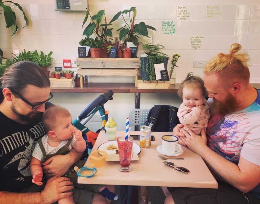 Dads and their babies eating, drinking and socialising at the cafe