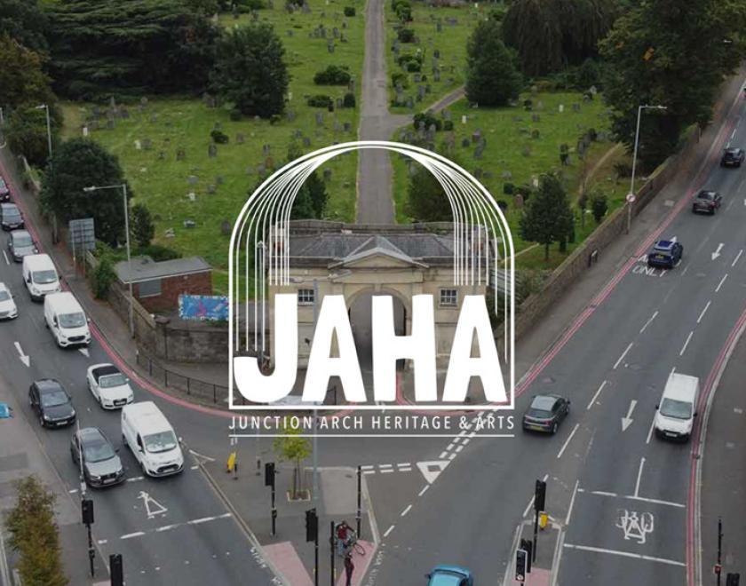 JAHA logo over an aerial view of the Arch