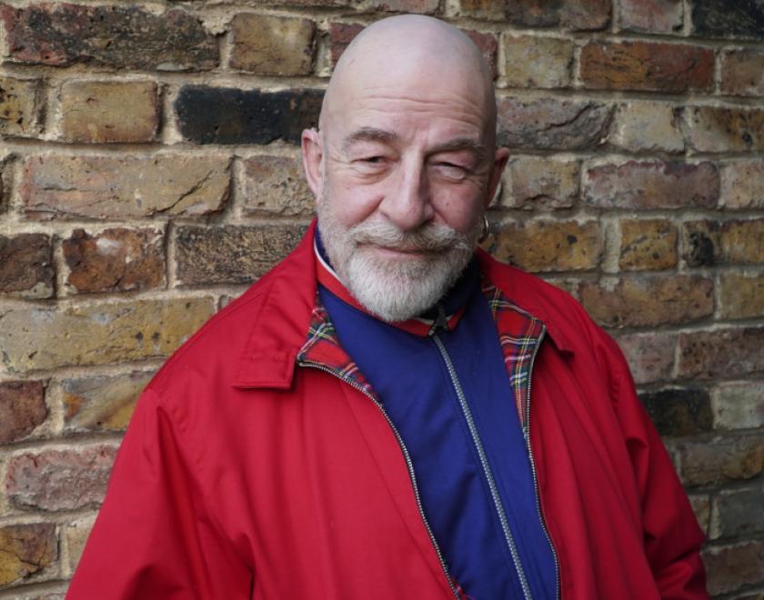 Jeff Innocent stood in front of brick wall