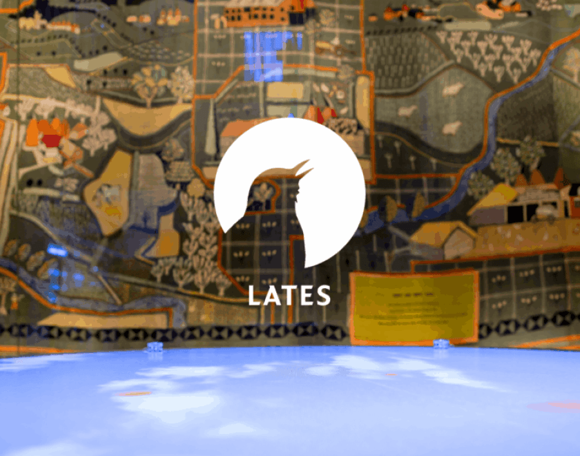 Lates logo over a background of a MERL gallery display
