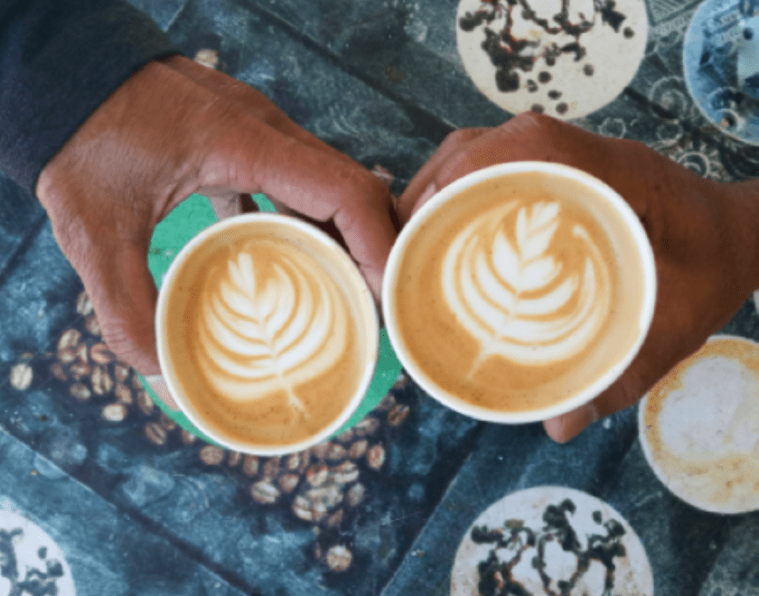 Image of two hands holding coffee cups with wording Come and join us.