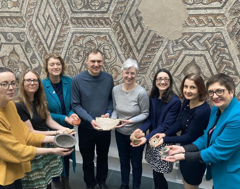 team at Reading Museum all holding Roman artefacts