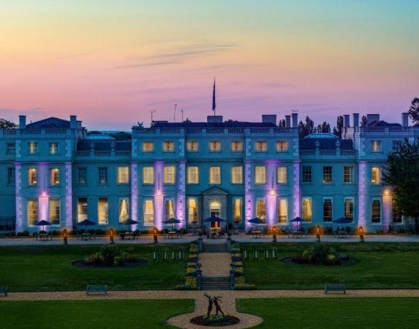 The image shows the Mansion House at dusk.